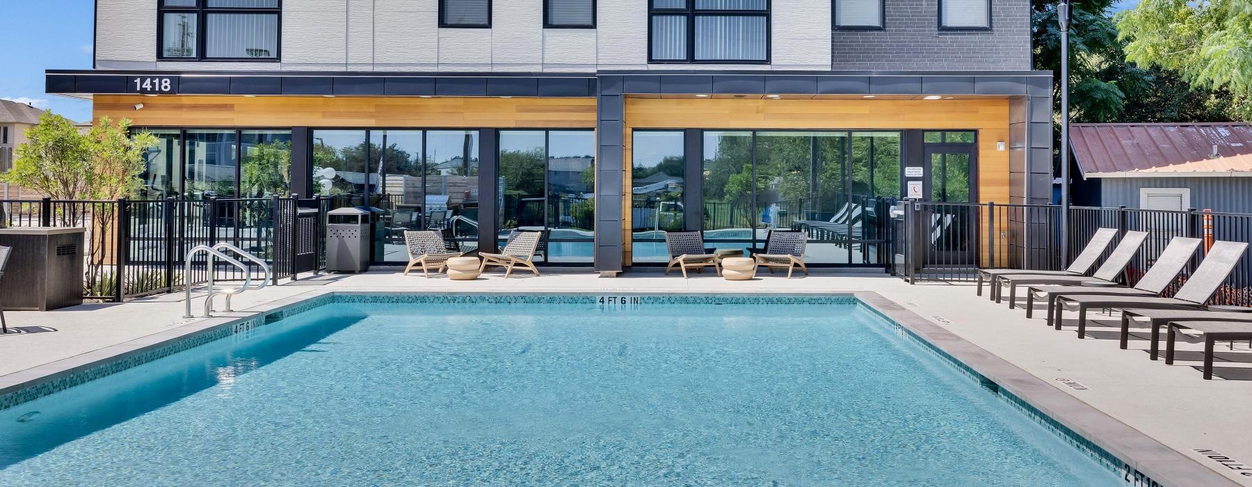 a swimming pool outside of a building